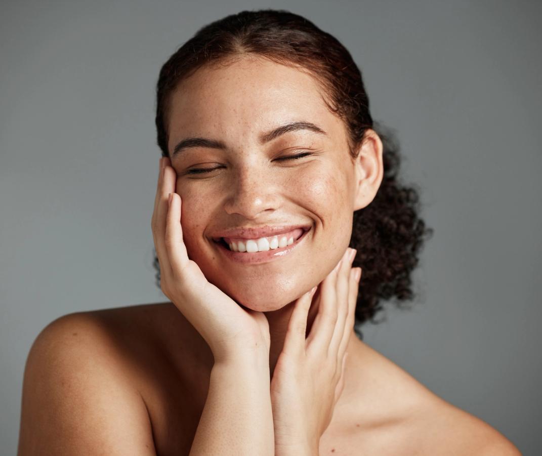 A woman smiling confidently